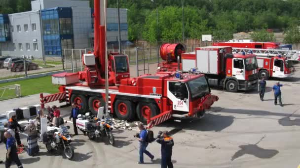 Fire trucks, fire engine with crane and motorcycles stand — Stock Video