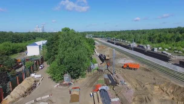 Excavator works on construction site of MKZD railway — Stock Video