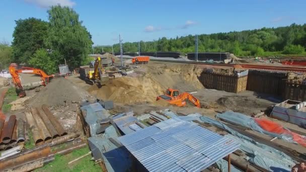 Excavator works on building site of MKZD railroad — Stock Video
