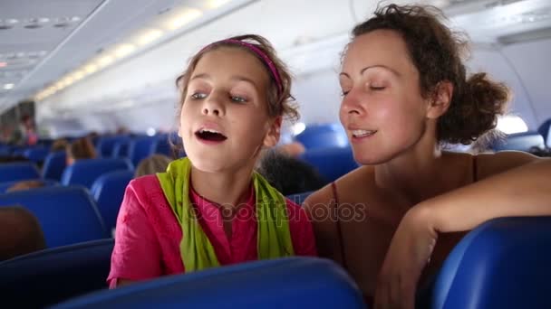 Mother Daughter Talk Sitting Cabin Flying Airplane — Stock Video