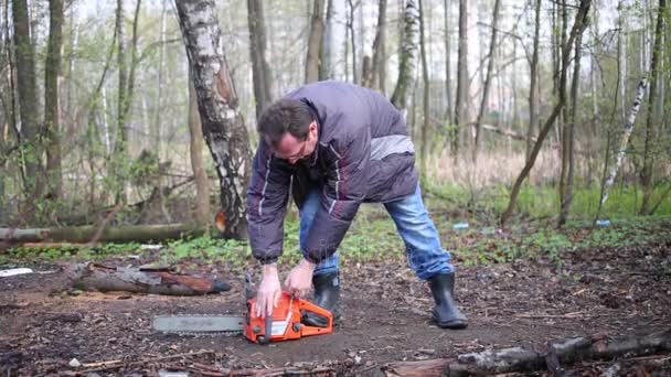 Man Pulling Rope Trying Start Chainsaw — Stock Video