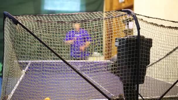 Man Practicing Table Tennis Using Automatic Feed Balls View Net — Stock Video