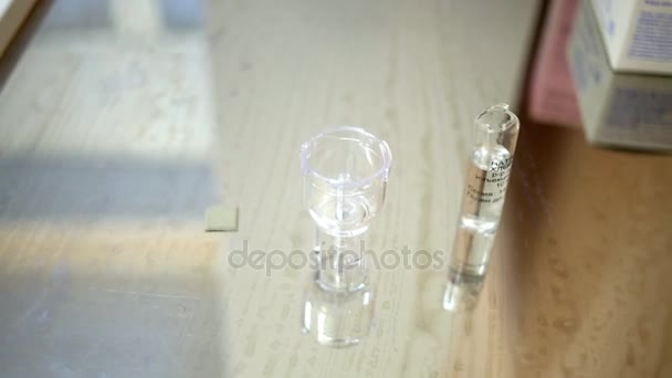 Opened Ampoule Saline Medical Cup Table — Stock Video