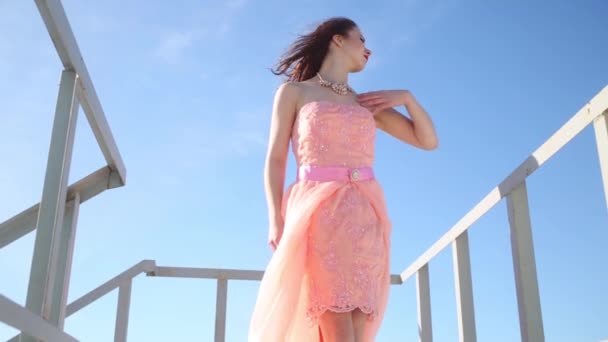 Woman Pink Dress Throwing Her Hands Touching Dress Next Handrail — Stock Video