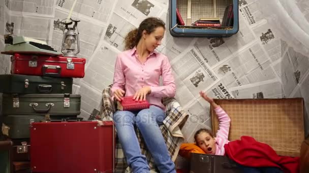 Moscow Sep 2015 Woman Reads Book Girl Lies Suitcase Cardboard — Stock Video