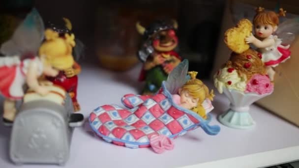 Closeup Beautiful Little Dolls Wings Toys Shelf — Stock Video