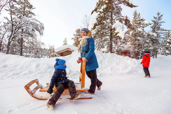 Mother and kids outdoors on winter — Stock Photo, Image