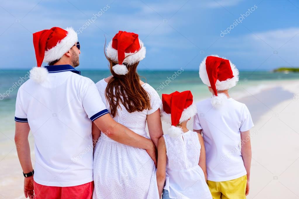 Family celebrating Christmas at beach
