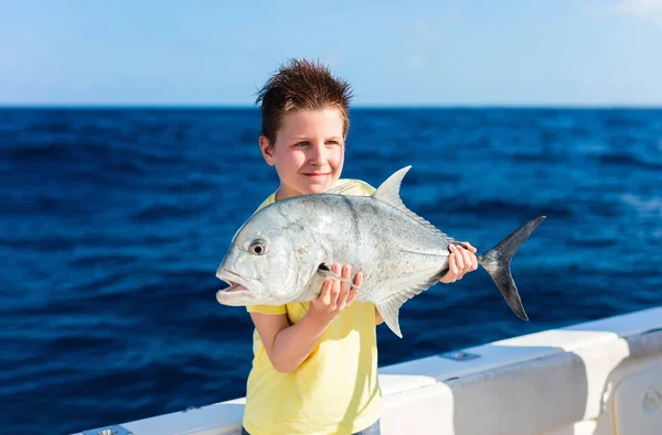 Boy deep sea fishing — Stock Photo, Image