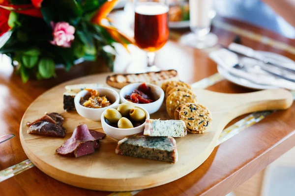 Appetizers on beer platter — Stock Photo, Image