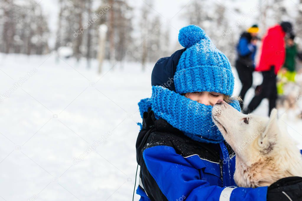 Little girl with husky dog