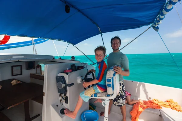 Boy drives catamaran — Stock Photo, Image