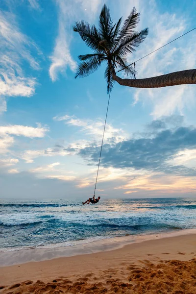 Teenage boy swinging — Stock Photo, Image