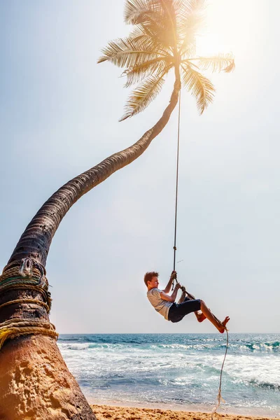 Cute Teenage Boy Having Fun Swinging Rope Tropical Island Beach — Stock Photo, Image