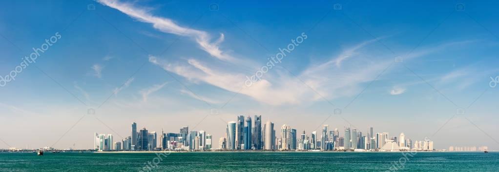 Panoramic view of Doha Qatar skyline on sunny day