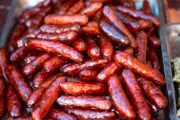 Close up of BBQ sausages at market