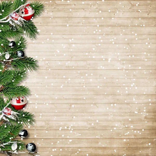 Christmas fir tree with snowfall and berries on a wooden board — Stock Photo, Image