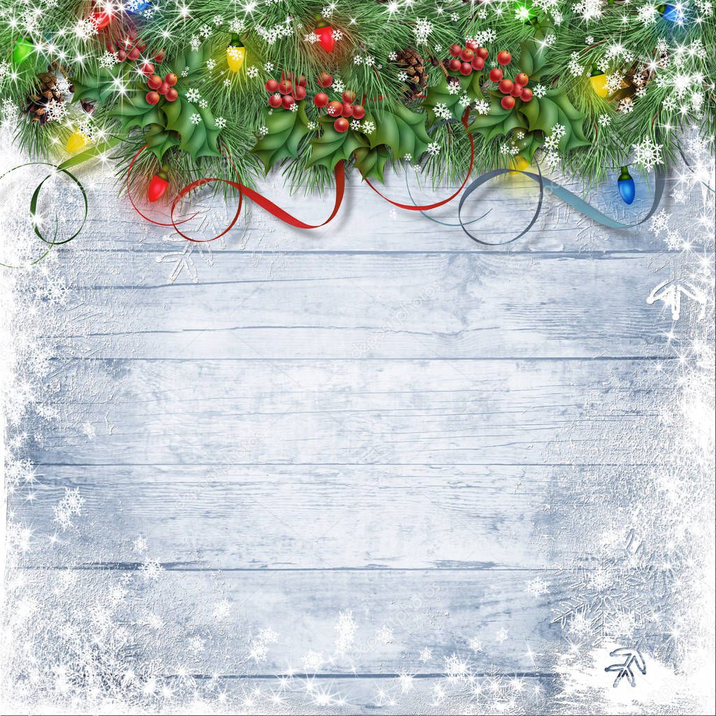 Festive garland with holly, lights and firtree on a snowy wooden