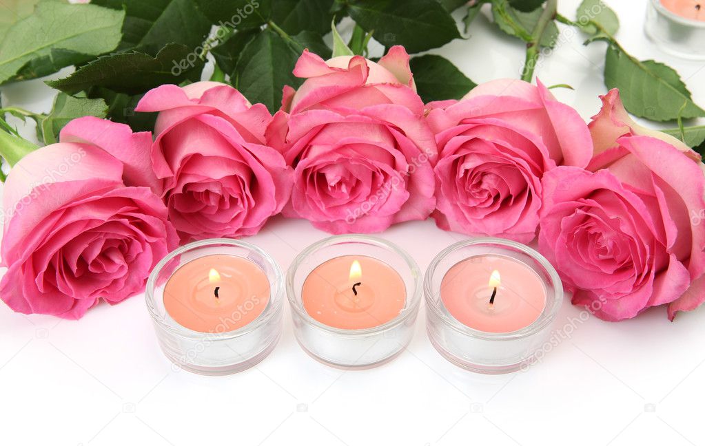 Pink Roses and candles on a white background — Stock Photo © Elena777