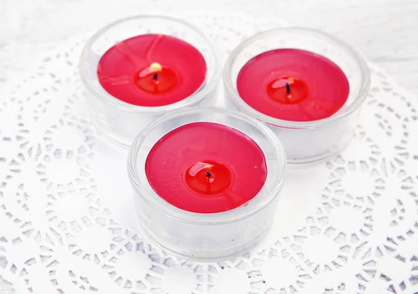 The burning candles  on a white background — Stock Photo, Image