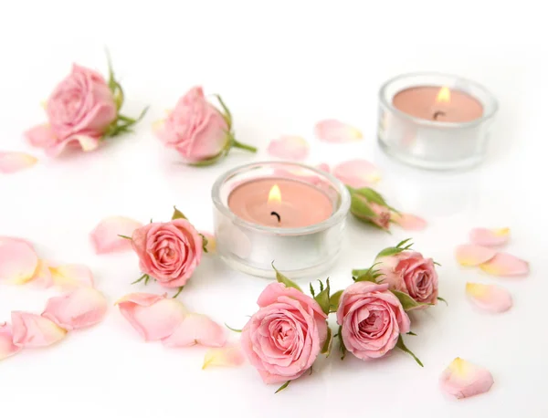 Pink roses and burning candles — Stock Photo, Image