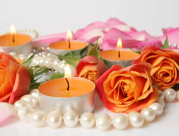 Beautiful flowers and candles — Stock Photo, Image
