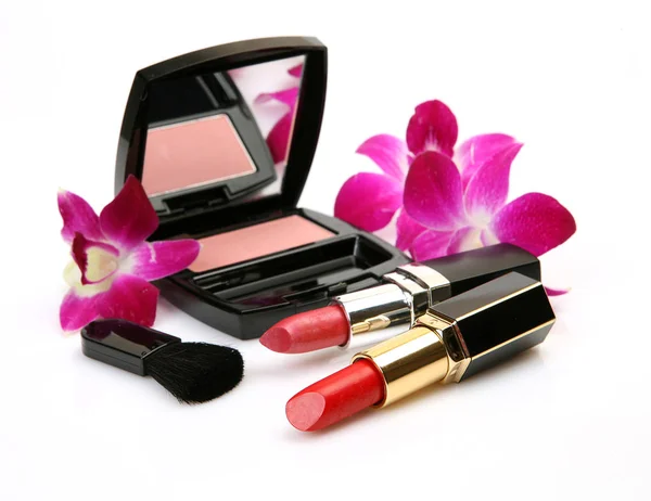 装饰性化妆品和粉红色兰花 — 图库照片