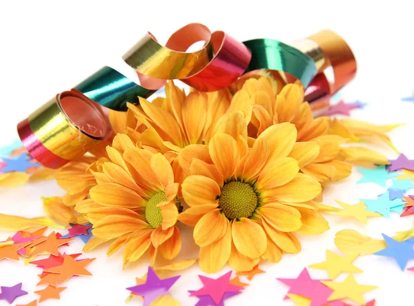 Yellow flowers and colorful stars confetti on white background — Stock Photo, Image
