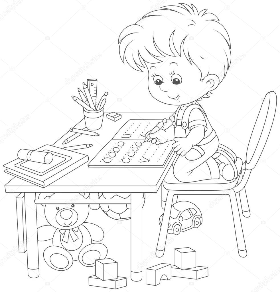 Little boy doing his homework in an exercise book with samples of writing, a black and white vector illustration in a cartoon style