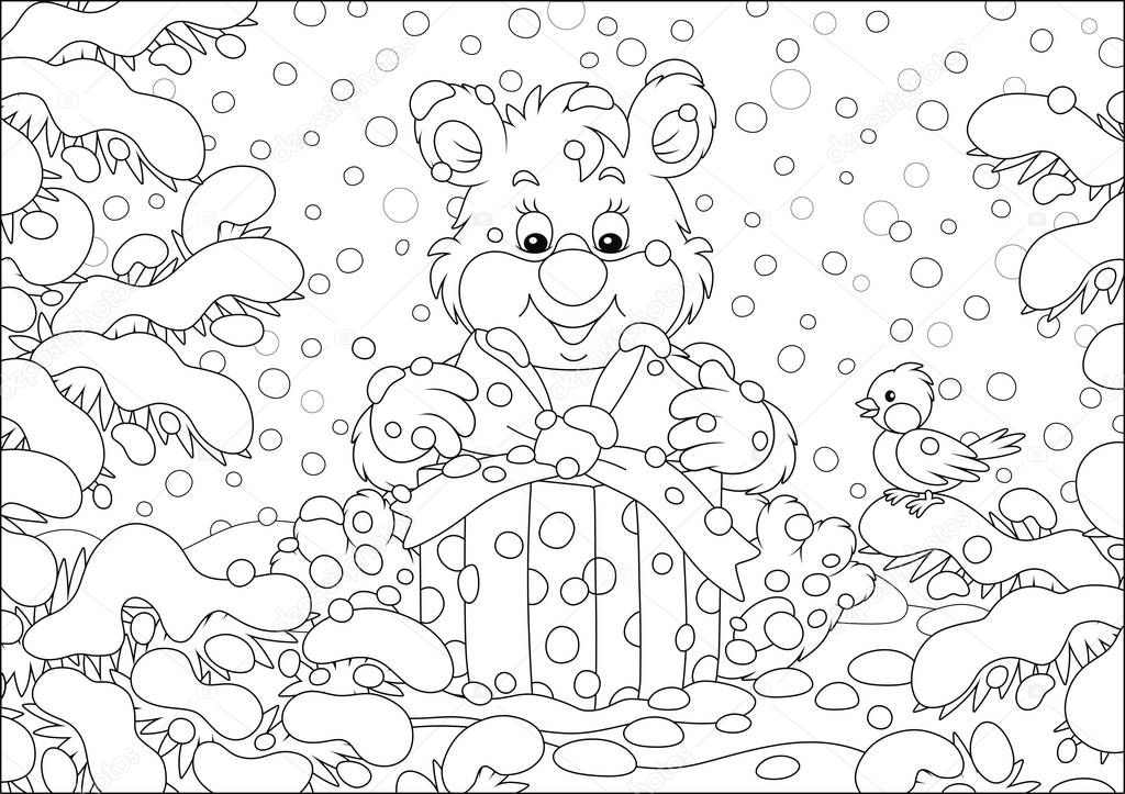 Little bear with a Christmas gift under snow-covered fir branches in a winter forest on a beautiful snowy day, black and white vector illustration in a cartoon style