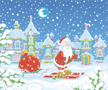 Noel Baba kayak yapıyor ve Noel hediyeleriyle dolu çantasını Noel arifesinde karla kaplı bir kış kasabasında kızağında taşıyor.