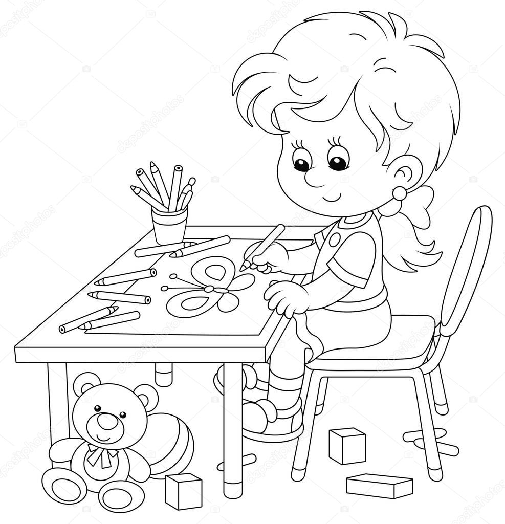 Smiling little girl sitting at her table and drawing with pencils a funny picture of a small beautiful butterfly, black and white outline vector cartoon illustration for a coloring book page