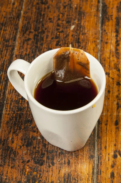 Black tea in white cup — Stock Photo, Image