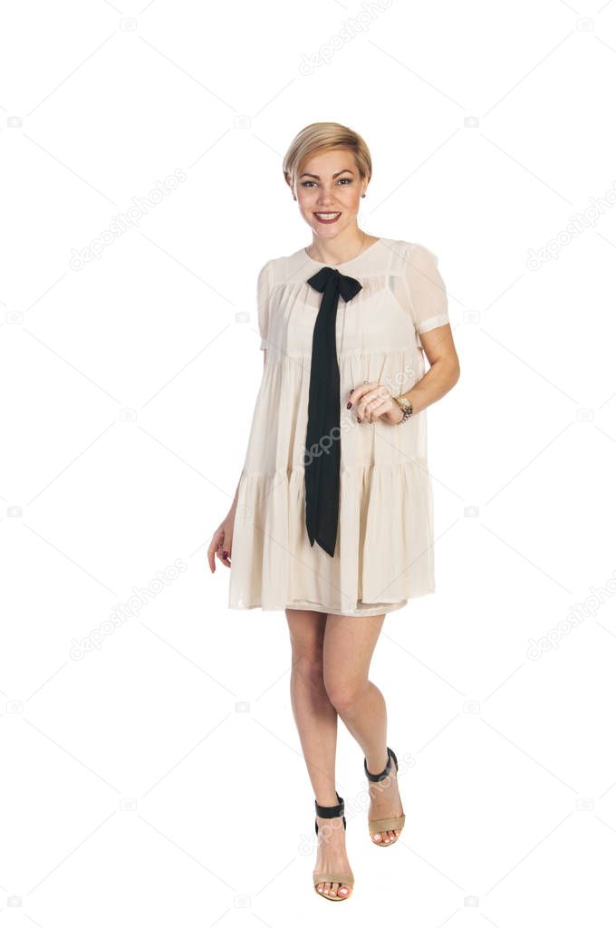 Beautifull woman in beige dress on white