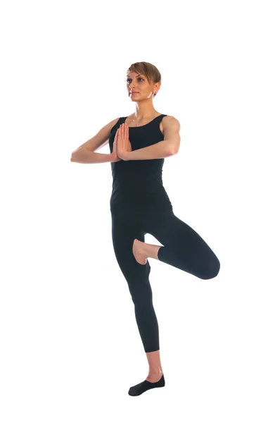 Femme en pose de yoga isolé sur fond blanc Image En Vente