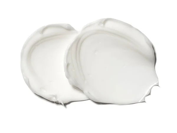 Smear paint of white cosmetic products — Stock Photo, Image