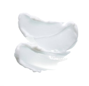 Beyaz desen ve yüz kremi lekesi veya beyaz arkaplanda izole edilmiş beyaz akrilik boya