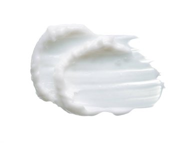 Beyaz desen ve yüz kremi lekesi veya beyaz arkaplanda izole edilmiş beyaz akrilik boya