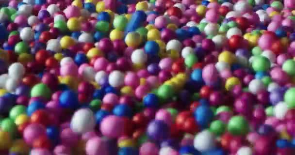 Multi Colored Balls Falling Scattering Different Directions Rolling White Surface — 비디오
