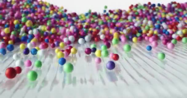 Multi Colored Balls Falling Scattering Different Directions Rolling White Surface — Stock Video