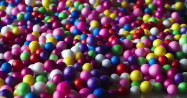 Multi Colored Balls Falling Scattering Different Directions Rolling White Surface — Stock Video