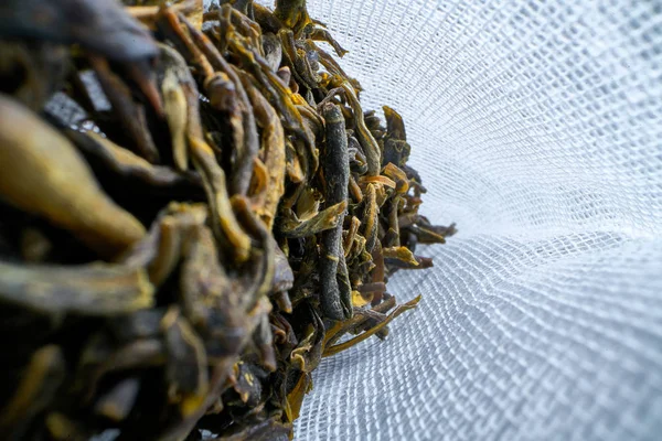 Inside a tea bag herbal tea on a light background