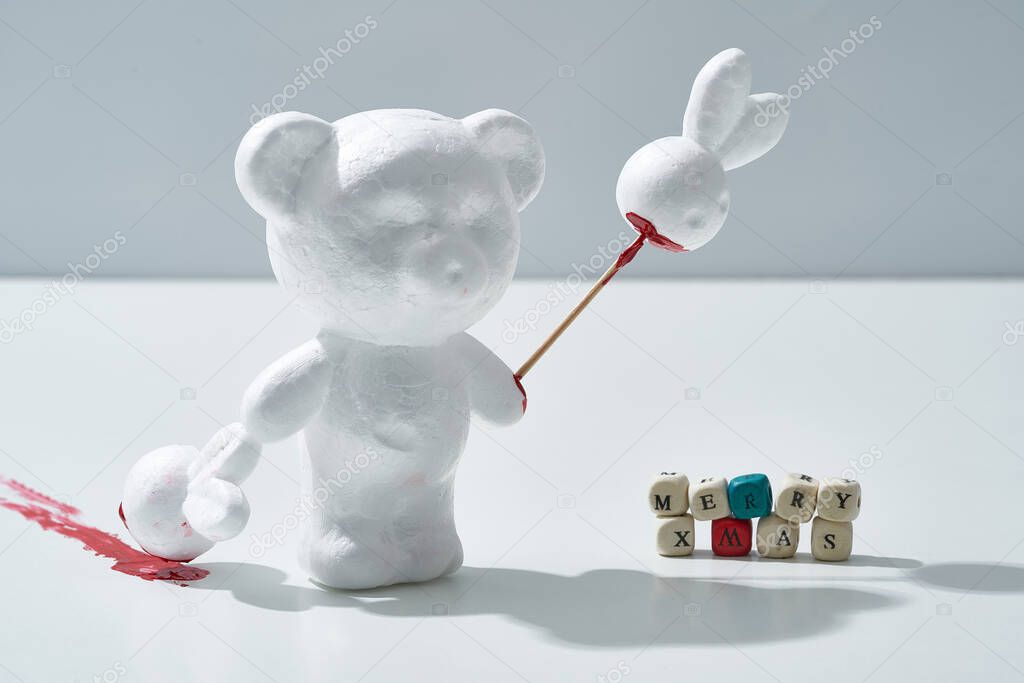Bloody Christmas scary celebration scene, white animals, hares and bears made of plastic celebrate holiday in the forest                              