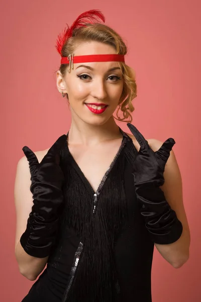 Pretty actress in black retro dress with headband — Stock Photo, Image