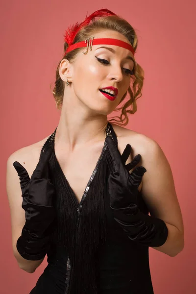 Pretty actress in black retro dress with headband Royalty Free Stock Photos