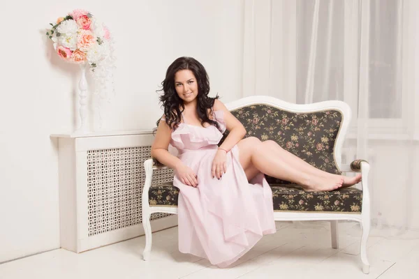 Emotional attractive young woman posing in a boudoir — Stock Photo, Image