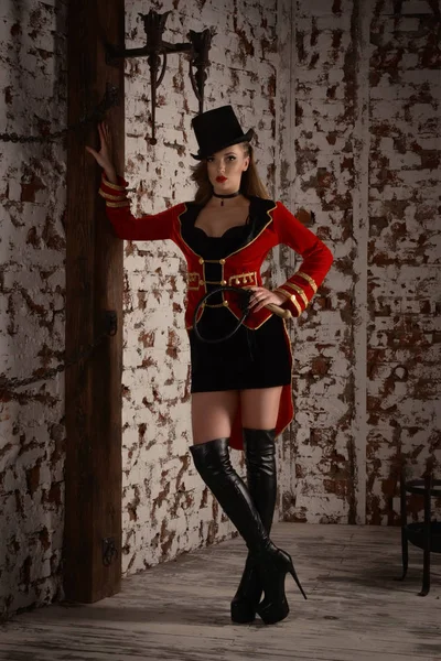 Beautiful woman trainer in a circus suit — Stock Photo, Image