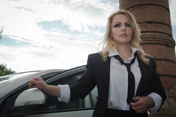 Noir film style woman in a black suit — Stock Photo, Image