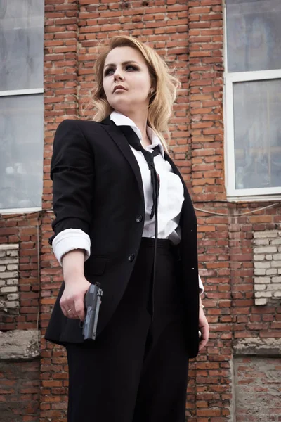 Noir film style woman in a black suit — Stock Photo, Image