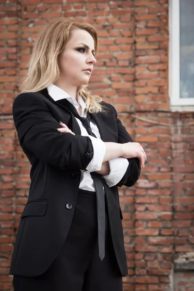 Noir film style woman in a black suit — Stock Photo, Image